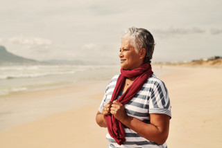Senior person enjoying a sunny day at the beach