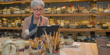 Artist Using Digital Tablet For Online Learning Teaching Of Pottery