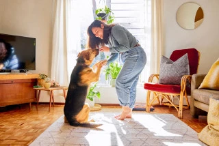Woman and her dog inside house