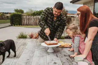 Family out on the deck at a table