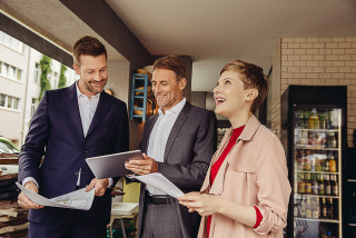 Business people discussing plans for office.