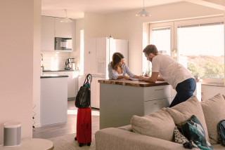 Couple with suitcases preparing for travel