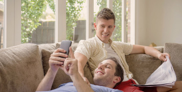 Couple sitting on sofa chatting