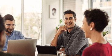 Employee smiling in business meeting