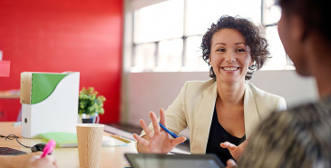 Employee smiling in a meeting room