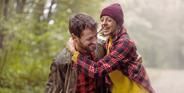 Friends embracing while out on a walk