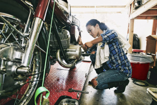 Mechanic working on motorbike