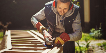 Person outside sanding stair banister 