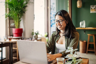 International student studying on laptop