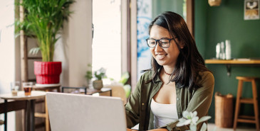 International student studying on laptop