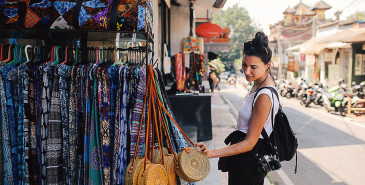 Tourist browsing stalls in a street market