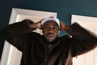 man holds his hands on his head