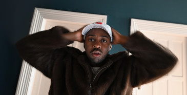 man holds his hands on his head