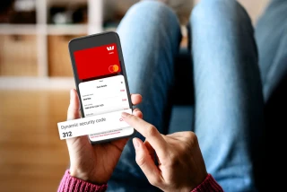 Person using dynamic CVV for secure online purchase