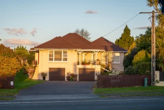 Front view of a house at sunset