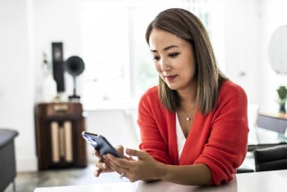Woman on phone in kitchen