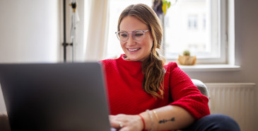Woman inside her home on laptop