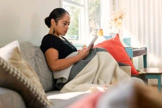 Young women reading book