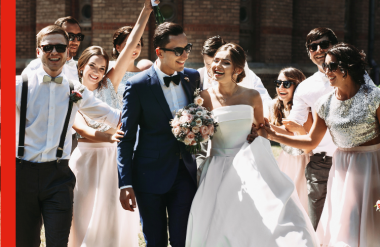 A Bride and Groom at a wedding surrounded by their wedding party