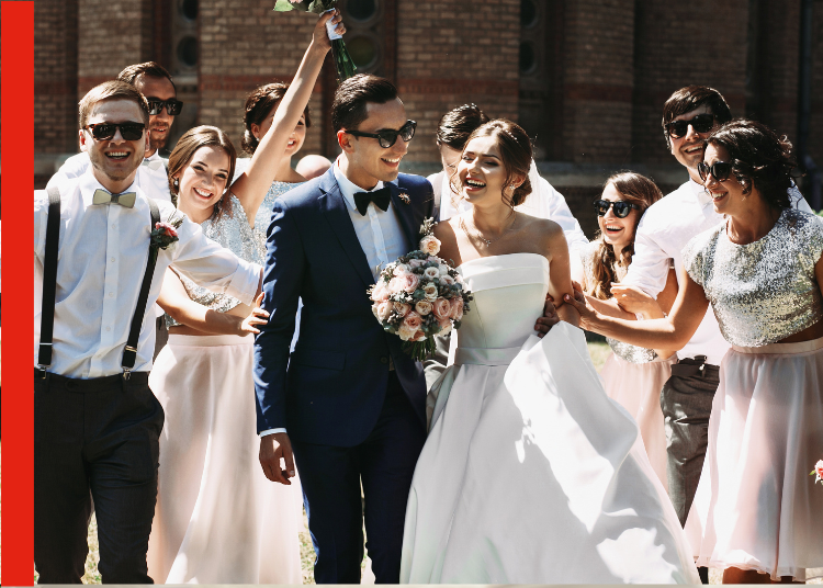 A Bride and Groom at a wedding surrounded by their wedding party