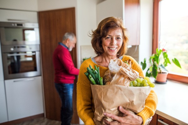 Grocery Discounts Woman holding groceries