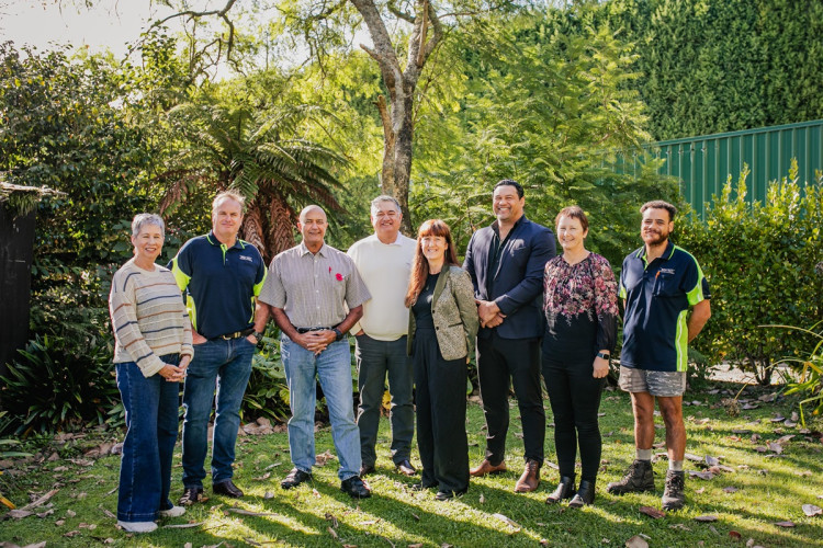 Group of people in front of trees