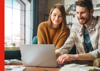 A couple looking at a laptop