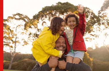 Photo of family after buying their first home