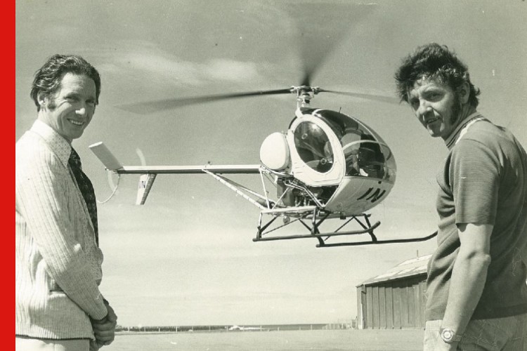 Photo of Peter Button with a helicopter